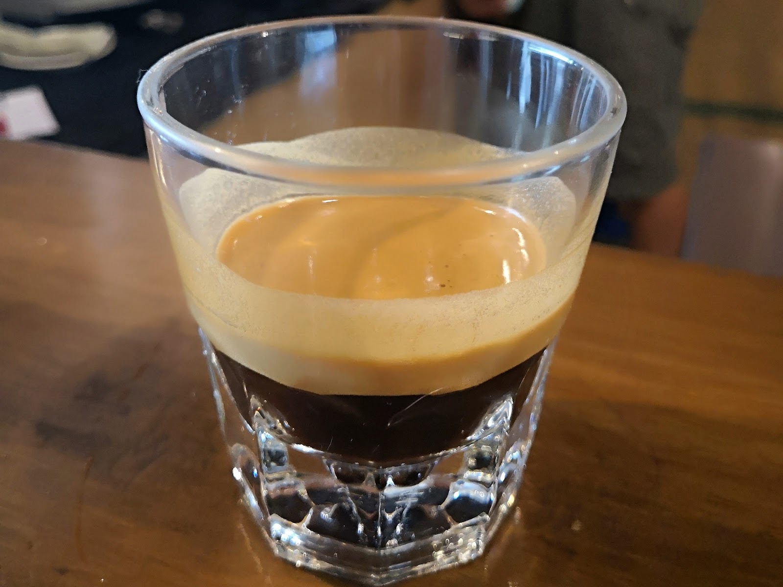Single espresso shot with crema